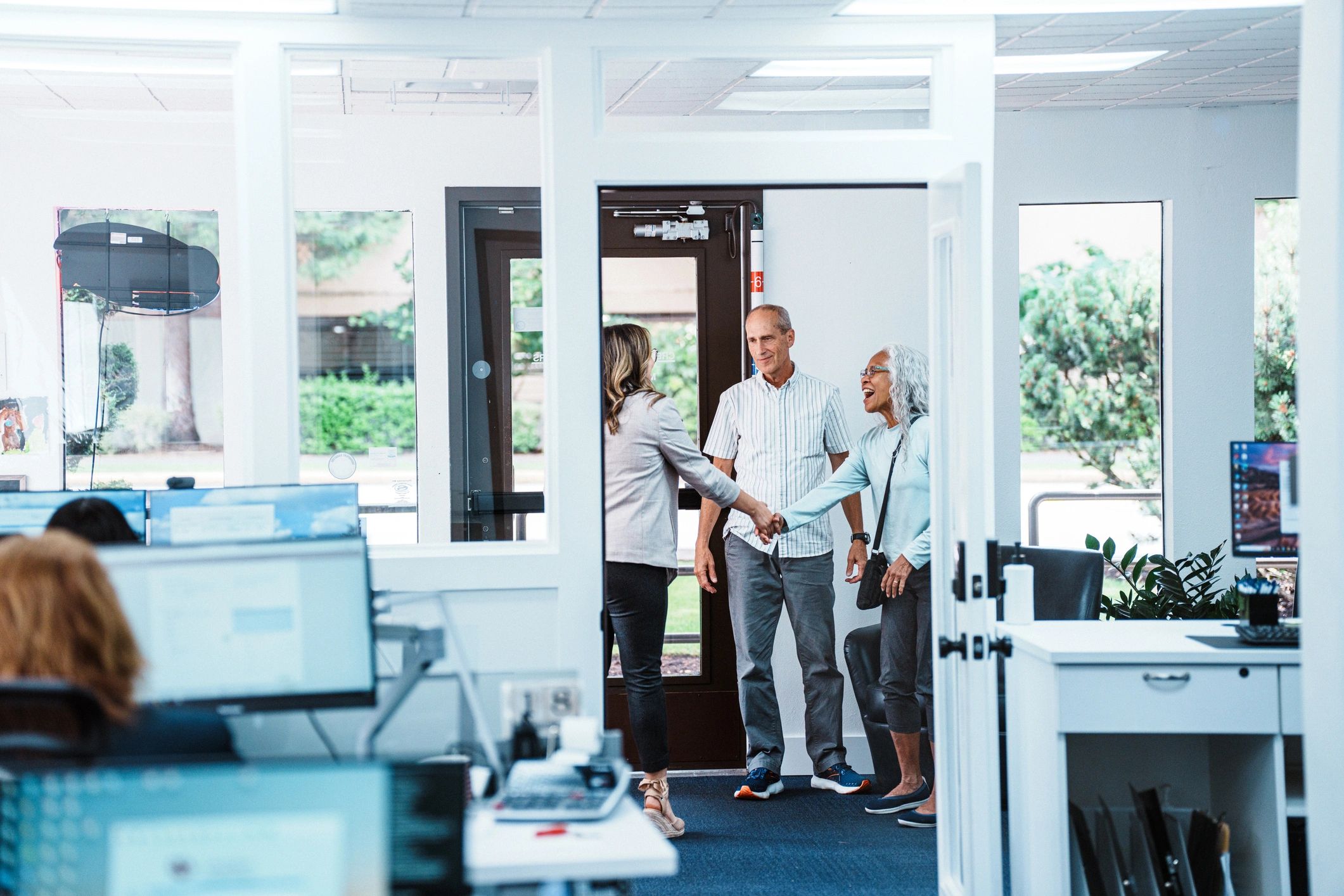 Customer support team assisting clients in a financial office